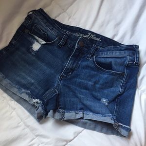 Dark denim shorts w/ small rips